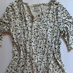 White with black leaves design shirt